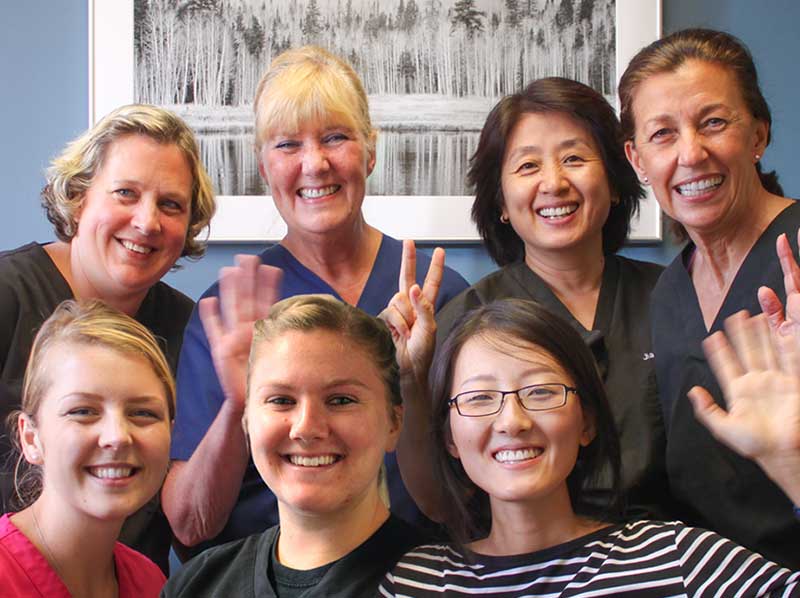 Dr. Sheng and staff smiling