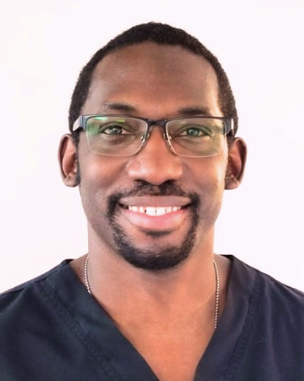 a picture of Rasson smiling in front of a white background.